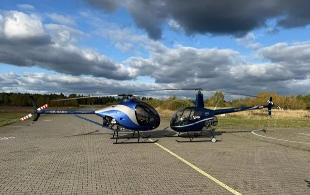 ARGO AH Helicopter in flight over landscape